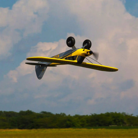RC Airplane Carbon Cub S 2 1.3m Ready To Fly Basic With SAFE Technology in flight, showing underside and propeller action.