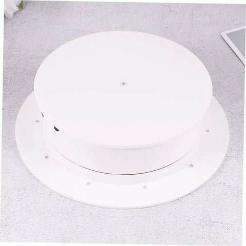 Top view of MiniKEYA Electric Rotating Display Stand USB Powered Turntable with white sturdy base and mirrored surface.