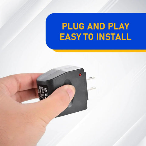Hand holding Hassle Free 220V AC To 12V DC Power Inverter With Universal Cigarette Lighter Plug, compact, easy to install.