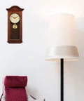Gold Metal Clock Pendulum Replacement For Traditional Quartz Wall Clocks With Accurate Timekeeping And Silent Operation hanging next to a lamp
