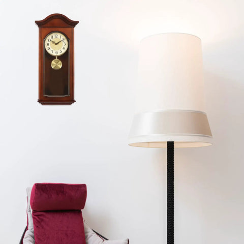 Gold Metal Clock Pendulum Replacement For Traditional Quartz Wall Clocks With Accurate Timekeeping And Silent Operation hanging next to a lamp