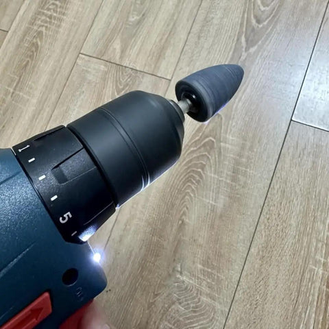 Electric drill with a cone-shaped aluminum oxide mounted grinding stone from the Eight Piece Pro Grade Set for precision tasks.