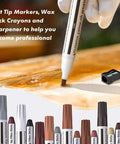 No Sweat Wood Repair Kit Featuring Sleek Touch Up Markers Plus Quality Wax Sticks For Quick Floor And Furniture Fixes In Assorted Rich Wood Tones For A Smooth Knockout Transformation showcasing felt tip markers and wax sticks laid out.