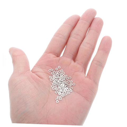 Person holding Heavy Duty Metal Eyeglass Screw Washers For Frameless Glasses Repair Kit With 200 Pieces Nut Washers in hand