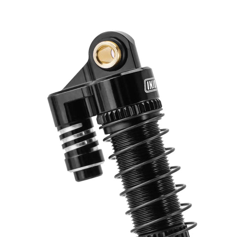 Close-up of Beefed Up Brass And Aluminum 59mm Long Threaded Oil Shock for TRX4M RC Car Upgrade with CNC Machined Shock Bodies.