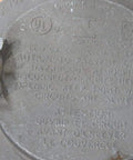 Front view of round metal Crouse-Hinds explosion-proof junction box cover, 2 in, with embossed warning text and side lugs.