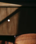 Six Pack White Alloy Cabinet Handles Single Hole Round Drawer Pulls For Cabinets shown on wooden furniture surface