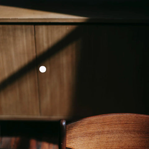 Six Pack White Alloy Cabinet Handles Single Hole Round Drawer Pulls For Cabinets shown on wooden furniture surface