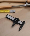 2pcs ABS Wheel Bolt Spacing Tool for Wheel Hub Precision Measurement on wooden surface with measuring tools.