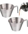Two Pack 3.4 Oz Stainless Steel Espresso Dosing Cups With Handle V Shaped Spout And Built In Scale Barista Grade Gear For Home Brews Espresso Machine Accessories For Bar Home Or Party displayed pouring espresso.