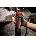 Hand using M12 cordless tool with RedLithium 2.0 Ah Compact Battery Pack For M12 Cordless Tools Built Tough Longer Run Time
