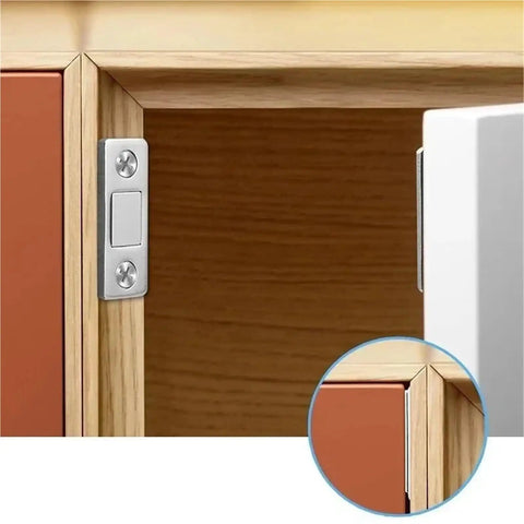 Self-Adhesive Magnetic Cabinet Catches with Invisible Drawer Locks installed on wooden cupboard, close-up view