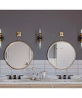 Two Light Clear Glass Farmhouse Bath Vanity Light In Antique Bronze Finish mounted over double sink vanity in bathroom