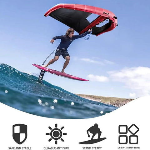 Man using Inflatable Surf Wing For Water Sports, Handheld Wind Wing Kite Surf Gear over waves, showcasing surfing capabilities.