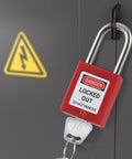 50 Piece Lockout Tagout Padlock Kit With Differently Keyed Safety Locks installed on electrical panel with warning sign.