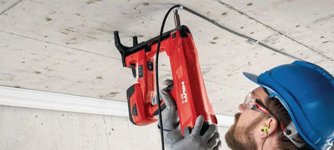 Worker installing ceiling with tool for High Performance X-P 17 B3 MX Bulk Nails, 11 16 Inch Shank, Heavy-Duty Collated Nails.