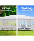 10 By 30 Outdoor Party Tent For Weddings And Events With Heavy Duty Canopy Water Resistant And UV Protected Includes Five Removable Sidewalls Ideal Garden Patio Backyard Gazebo White set up with tables and chairs on grass.