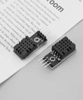 Two DHT20 temperature humidity sensors with I2C interface on paper, ideal for HVAC systems and microcontrollers use.