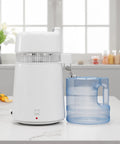 Top Notch Countertop Water Distiller With Rock Solid 900 Watt Heating Coil And Generous 1.6 Gallon Glass Pitcher on kitchen table.