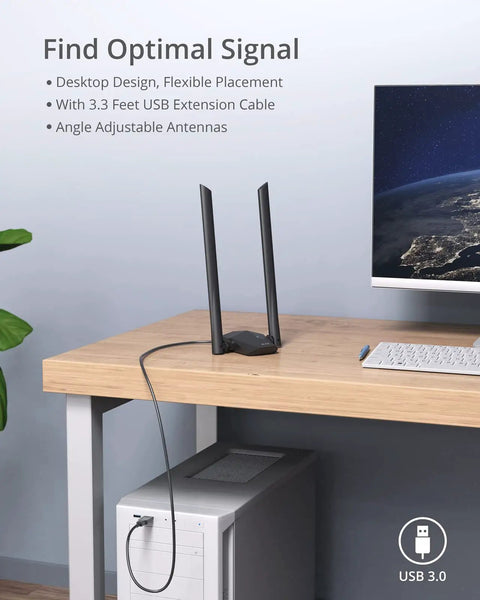 AX1800 USB WiFi 6 Adapter with 2 antennas on desk beside computer, USB cable connected to Windows PC tower.