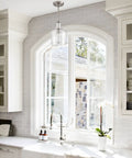 Bright kitchen with arched window and single brushed brass Farmhouse Gold Pendant Light For Kitchen Island With Milk Glass Rod-Hung Ceiling Fixture, Brushed Brass Finish, 1 Light, Modern Rustic Vibe, Sleek Boss Kitchen Decor.