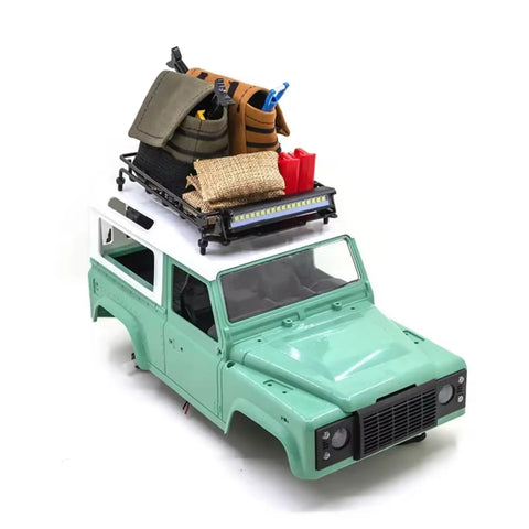 Premium 1/12 Scale Metal Luggage Carrier Roof Rack With Bright Light mounted on RC truck, displaying gear and supplies.