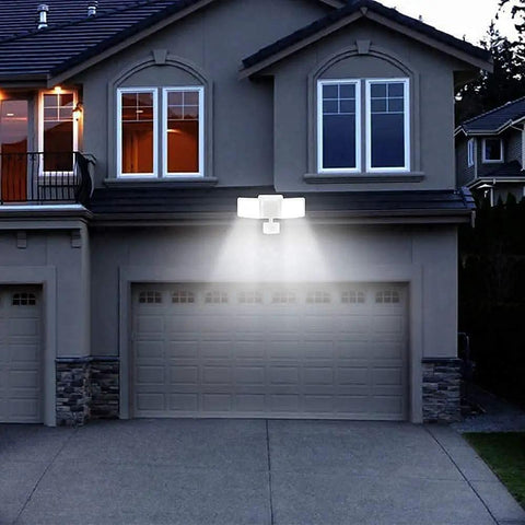 Outdoor Motion Sensor Light 20W LED Flood Fixture With 2 Adjustable Heads IP65 Waterproof illuminating garage at night