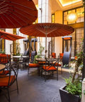 Outdoor patio with tables and Freestanding 11000W Gas Patio Heaters For Outdoor Warmth, Black Finish, Model BH0510001
