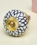 One Hundred Piece Set Of White Ceramic Floral Drawer Knobs And Cabinet Pulls For Kitchen Cabinets And Dressers with gold accents.