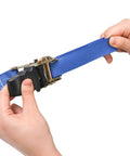 Hands adjusting blue ratchet strap from 18 Piece Tree Climbing Holds Set With Six Ten Foot Ratchet Straps For Outdoor Tree Climbing Kit