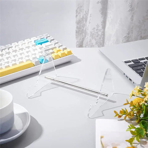 Clear Acrylic Keyboard Stand 1 Tier Desk Holder with a detachable metal bar on a white desk next to a keyboard and laptop.
