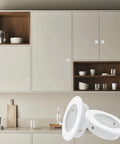 Recessed Cabinet Pulls 2 Inch Round White Flush Door Pulls Stainless Steel Finger Handles installed on modern kitchen cabinets