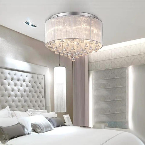 Flush Mounted Luxury Contemporary Drum Ceiling Chandelier Light Fixture With Cylinder Lamp Shade in bedroom with crystal rain drops