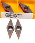 Premium Carbide External Turning Insert For Metal Machining VCMT160404-MA CNC Lathe Tool in a yellow case.