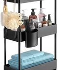 Slim 3 Tier Rolling Storage Cart On Wheels For Narrow Spaces Ideal For Bathroom Kitchen Laundry Room Black Space Saver Organizer With Easy Glide Wheels, loaded with toiletries and towels.