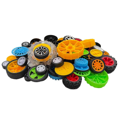 56 Piece Toy Wheel Set With Shafts For DIY Model Cars Trucks And Robots, various colored plastic rubber wheels in a pile