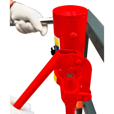 Close-up of red Heavy Duty Hydraulic Equipment Mover with Flow Back Handle Set of 2, 4,000 Lb Capacity, hand operating the handle.