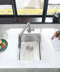 Top view of Undermount Bar Sink Workstation 15x19 Inch With Wood Cutting Board 16 Gauge Stainless Steel Single Bowl Deep Wet Bar Sink With Bottom Grid in kitchen setting.