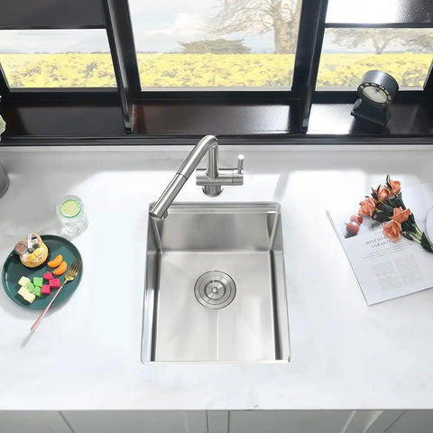 Top view of Undermount Bar Sink Workstation 15x19 Inch With Wood Cutting Board 16 Gauge Stainless Steel Single Bowl Deep Wet Bar Sink With Bottom Grid in kitchen setting.