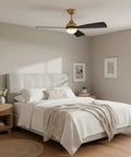 Bedroom with 44 Inch Indoor Outdoor LED Smart Ceiling Fan, 3 Blade Propeller, Heritage Brass and Matte Black, Scandinavian Style, installed above bed