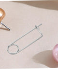Rock Solid Heavy Duty Stainless Steel Spring Lock Pins For Farm Hitches And Industrial Gear With Unbreakable Anti Vibration Stability That Slams Down Easy on fabric background.