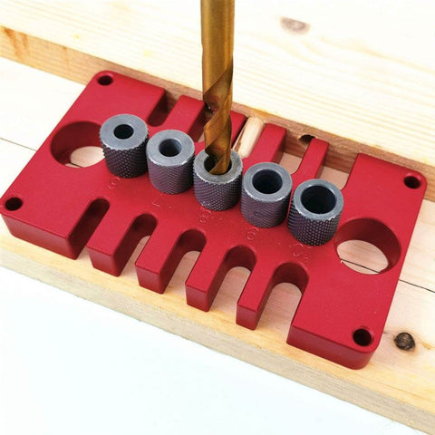 Punch Positioner Dowel Jig 3-In-1 Drill Guide Block for Woodworking on wooden surface, showcasing hole alignment