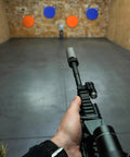 Shooter aiming at AR500 Steel Target Plates Three Eighths Inch Thick Six Inch Diameter High Vis Blue Gong Target for range training
