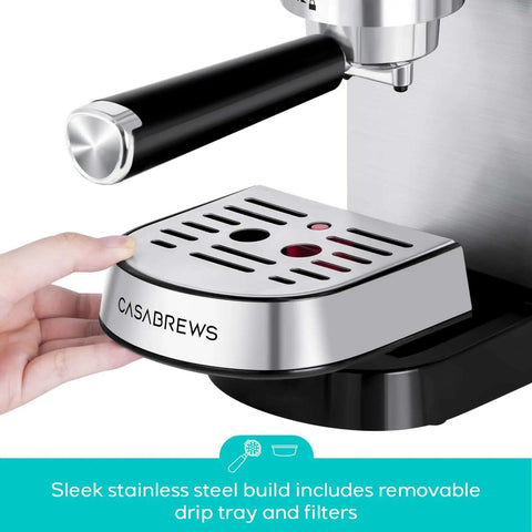 Close-up of Compact 20 Bar Espresso Machine With Steam Milk Frother, showing removable stainless steel drip tray, silver finish