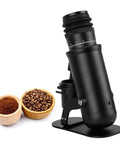 Badass Aluminum Single Dose Espresso Grinder Featuring Forty Eight Millimeter Conical Burrs And Sixty Adjustable Settings For Silky Smooth Low Clump Coffee Daily with coffee beans and grounds.