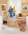 Extra Wide Swing Wooden Baby Gate For Large Openings, Adjustable From 60 To 103 Inches, 27 Inches Tall setup in living room