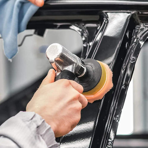Close-up of Car Detailing Drill Polishing Pad Kit With 39 Pcs used on vehicle frame with foam polisher for auto detailing.
