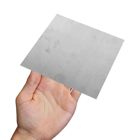 Two Piece Square Stainless Steel Sheet 100x100x2mm Flat Metal Plate Smooth Mill Finish For Industrial Fabrication Diy Projects Hardware Repair Built Tough Ready To Roll held in hand.