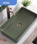 Top Shelf Matte Black Square Pedestal Bathroom Sink Deep Ceramic Washbasin No Fuss Finish Easy Clean Above Counter Vanity Base for Contemporary Homes And Daily Tasks in green color, above counter view.