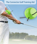 Golfer demonstrating Connector Golf Swing Trainer for posture correction with green foam aid on arm during swing.